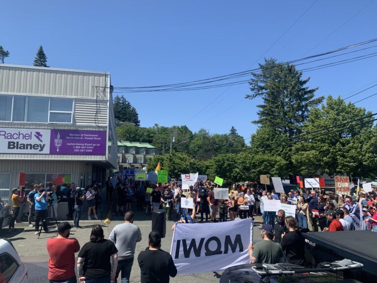 Hundreds rally at MP’s office in support of embattled salmon farms